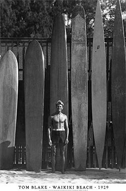 Tom Blake and some of his hollow surfboards on the right