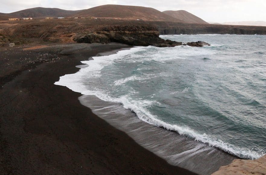 Black sand beach at Ajuy. But the beach is not the reason to go here.