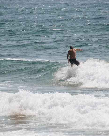Summer surf in boardshorts (2)