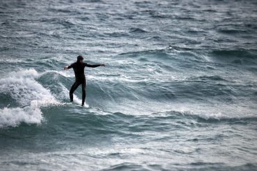 Surfer riding a small wave