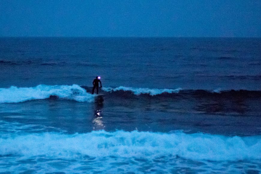 Night surfing with a headlamp. Photo: Miha Godec