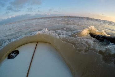 Surfing in coffee colored water