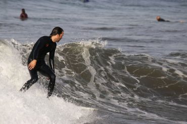 surfer on a wave in Tuscany