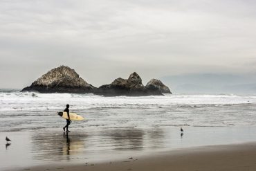 Surfer carrying a surfboard