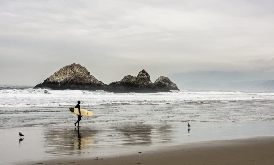 Surfer carrying a surfboard