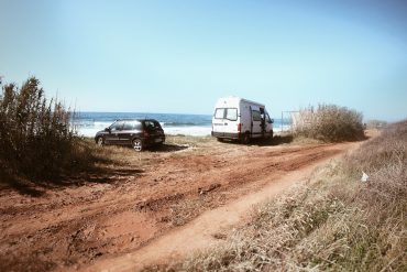 Van parked on the beach